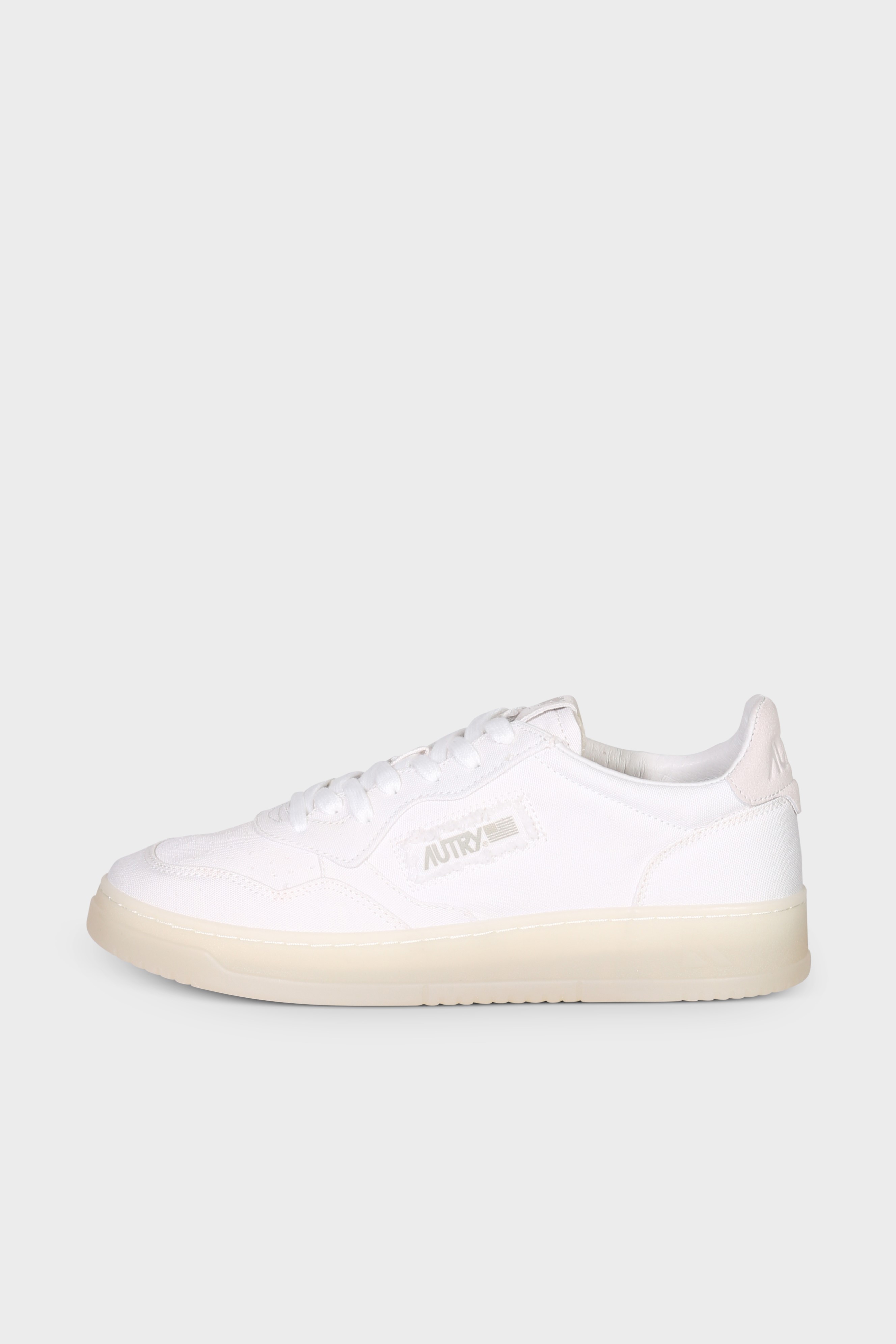 AUTRY ACTION SHOES Medalist Canvas Low Sneaker in White AUTRY ACTION SHOES Medalist Canvas Low Sneaker in White