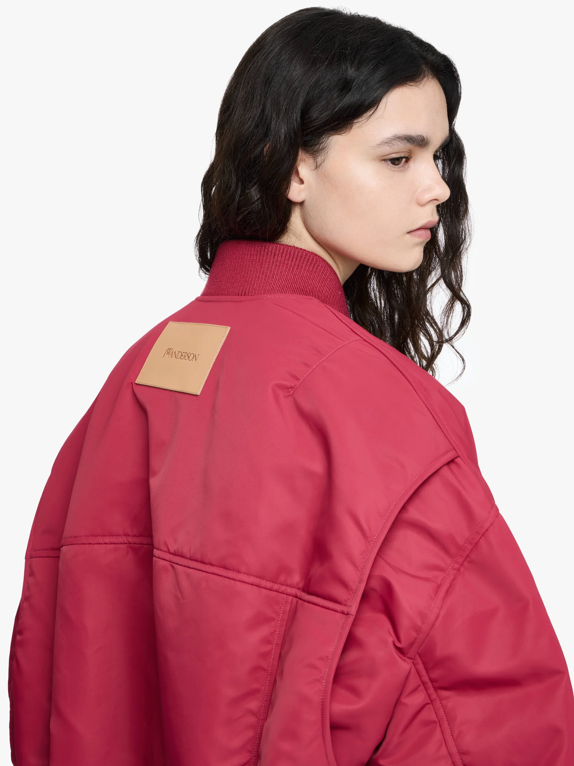 JW ANDERSON Oversize Curved Hem Bomber Jacket in Raspberry