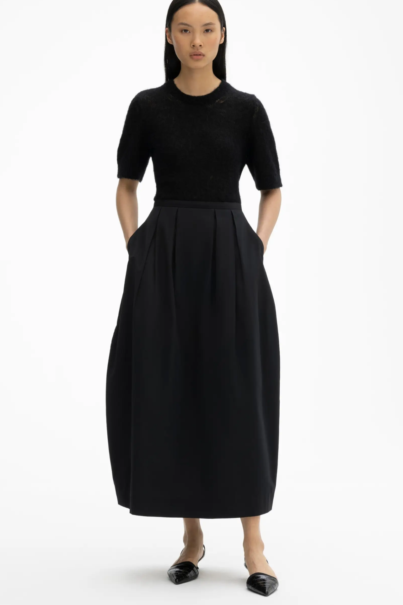 DAGMAR Curved Pleated Skirt in Black