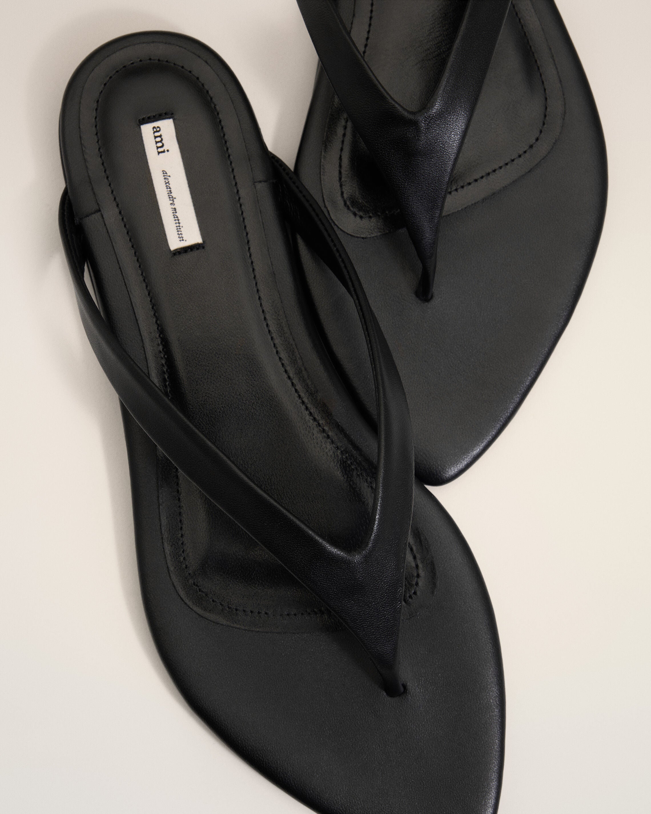 AMI PARIS Leather Flip Flops in Black